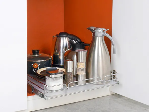 VEVOR pull out cabinet organizer with kettles, pots, and spice jars in a white and orange kitchen cabinet.
