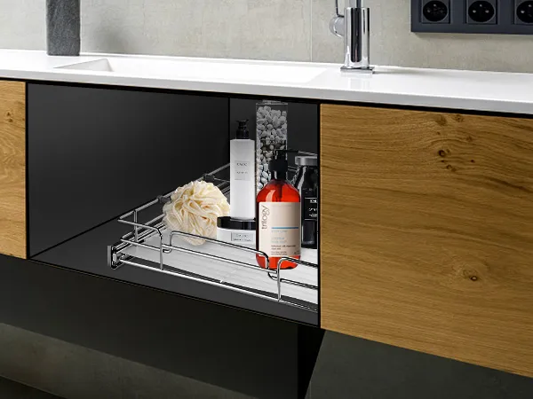 modern bathroom with open VEVOR pull out cabinet organizer showcasing toiletries and a loofah.