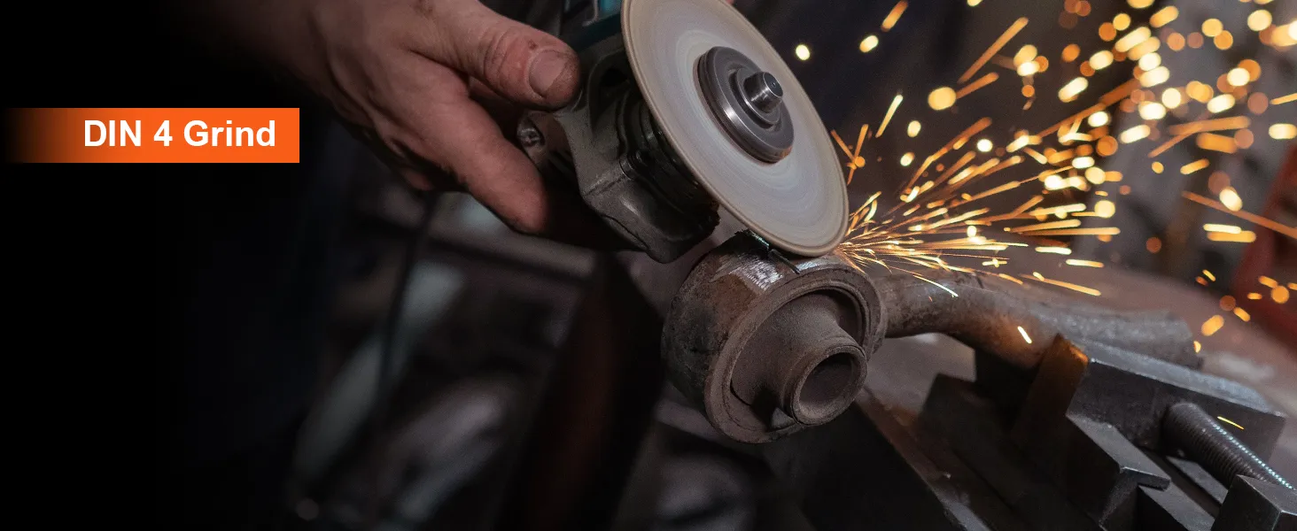 worker grinding metal with an angle grinder, creating sparks, din 4 grind text visible, VEVOR welding helmet.