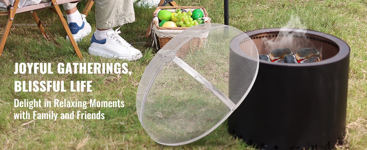 outdoor gathering with VEVOR fire pit screen, basket of fruits, and people relaxing on grass.