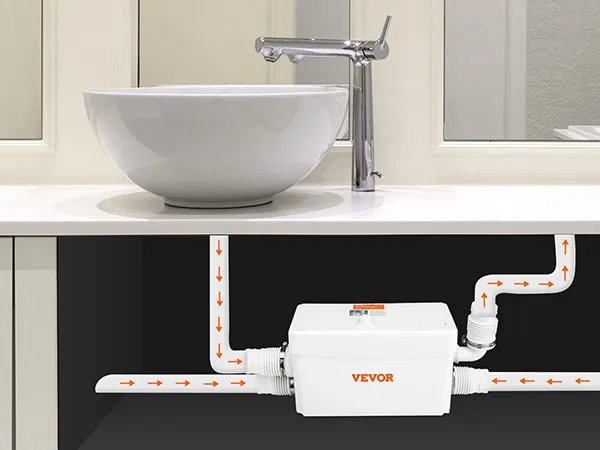 VEVOR macerator pump installed under bathroom sink with piping connections.