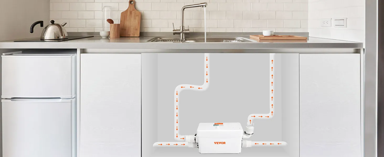 VEVOR macerator pump installed under a kitchen sink with visible piping connections.