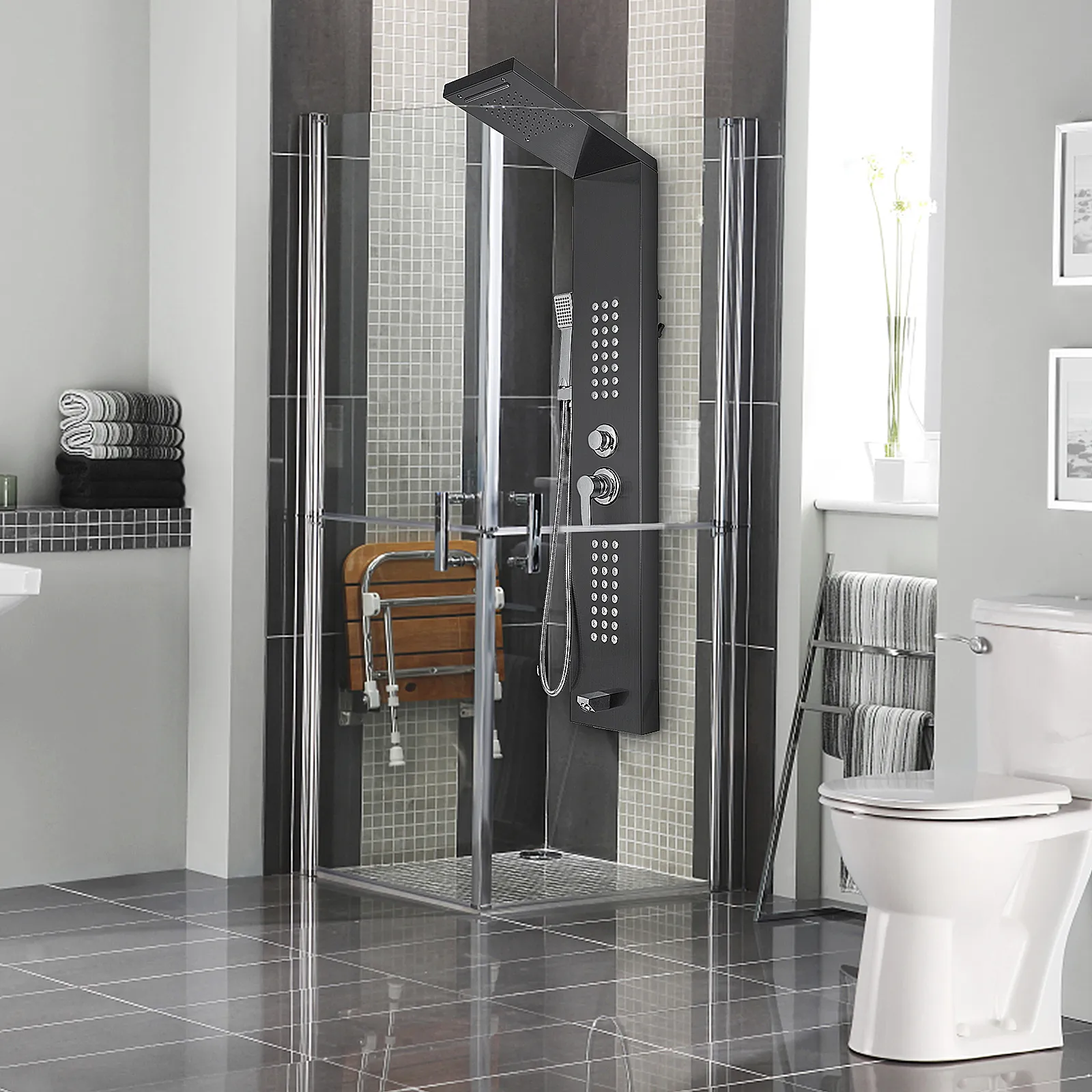 modern bathroom with VEVOR shower panel system, glass door shower, and tiled walls.
