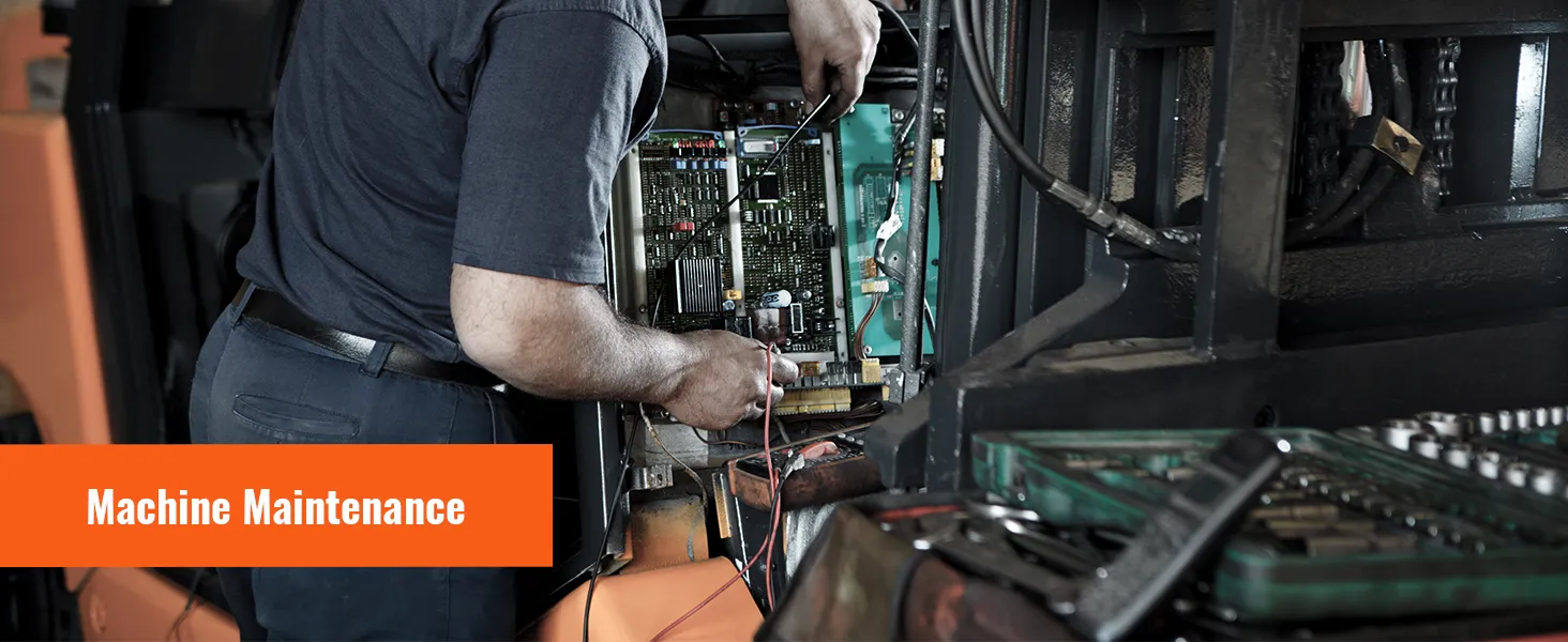 mechanic performing machine maintenance with tools and wiring on industrial equipment.