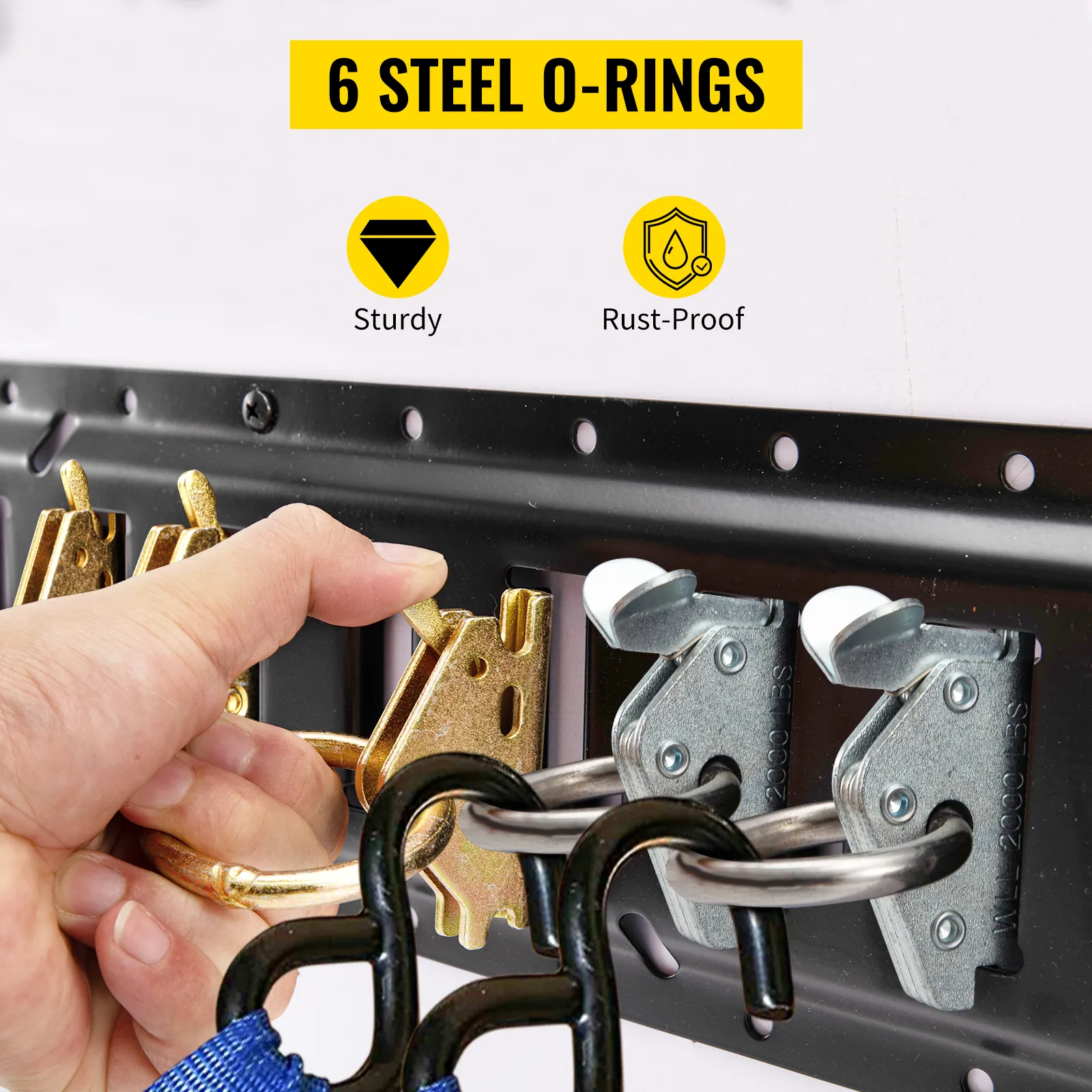 hand installing VEVOR e track tie-down kit with 6 sturdy, rust-proof steel o-rings. perfect for secure loads.