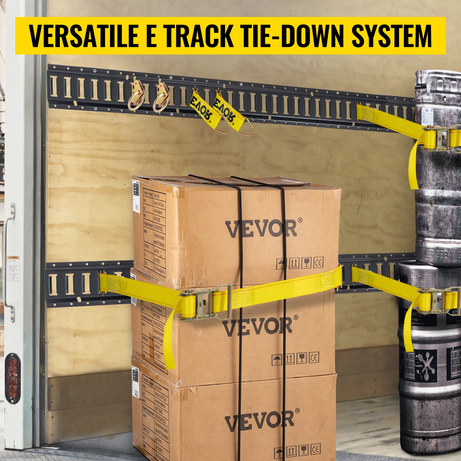 VEVOR e track tie-down rail kit securing boxes and barrels inside a cargo truck with yellow straps