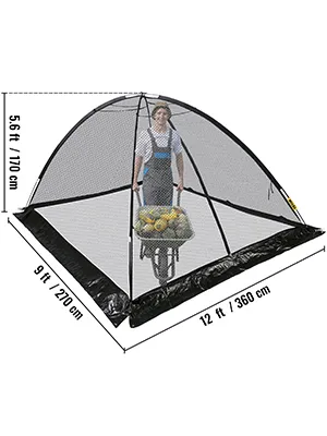 VEVOR pond cover dome, 12 ft x 9 ft x 5.6 ft, protecting a wheelbarrow with fruit.