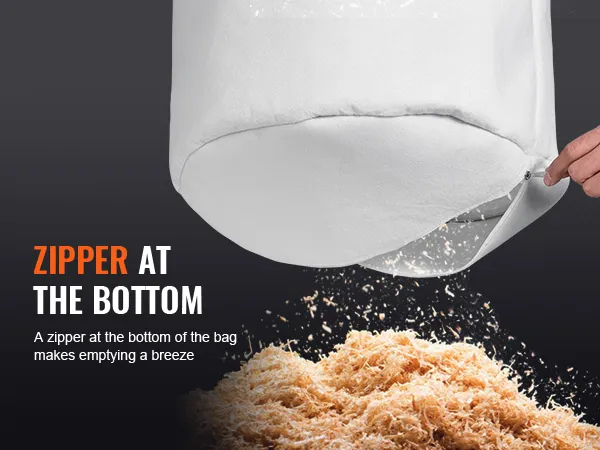 zipper at bottom of VEVOR dust collector bag being opened above a pile of wood shavings.