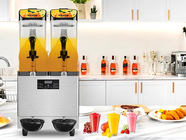 Máquina de granizados comercial VEVOR en una cocina moderna con bebidas de frutas, postres y pasteles en el mostrador.