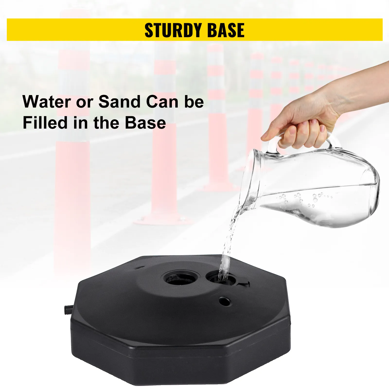 pouring water into the base of a VEVOR plastic stanchion kit on a road.