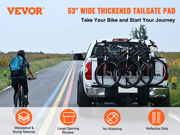 VEVOR tailgate pad on a truck carrying bicycles, promoting 53" thickened pad with waterproof material.