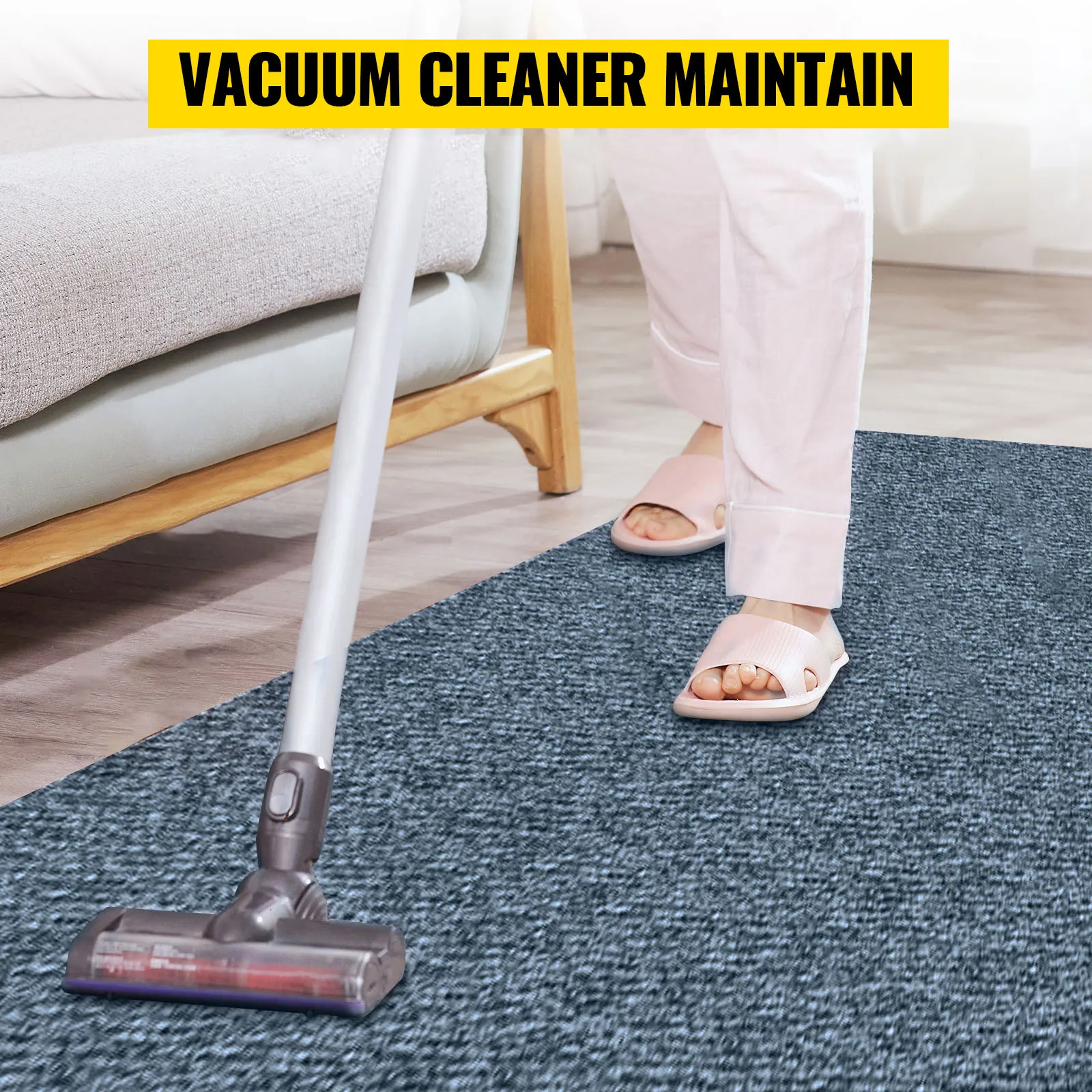 using a vacuum cleaner to maintain a VEVOR marine carpet in a stylish living room.