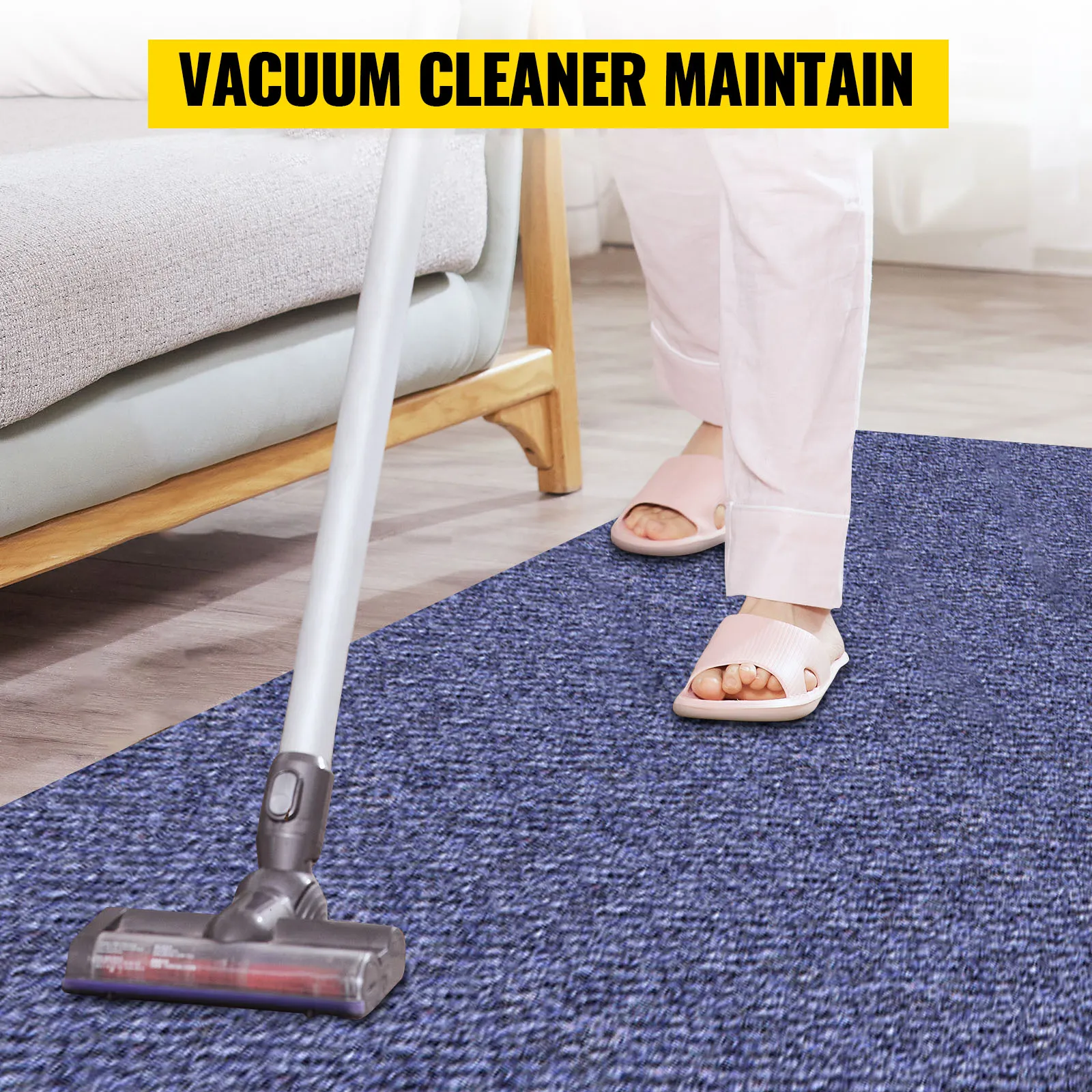 maintaining VEVOR marine carpet with a vacuum cleaner next to a sofa.