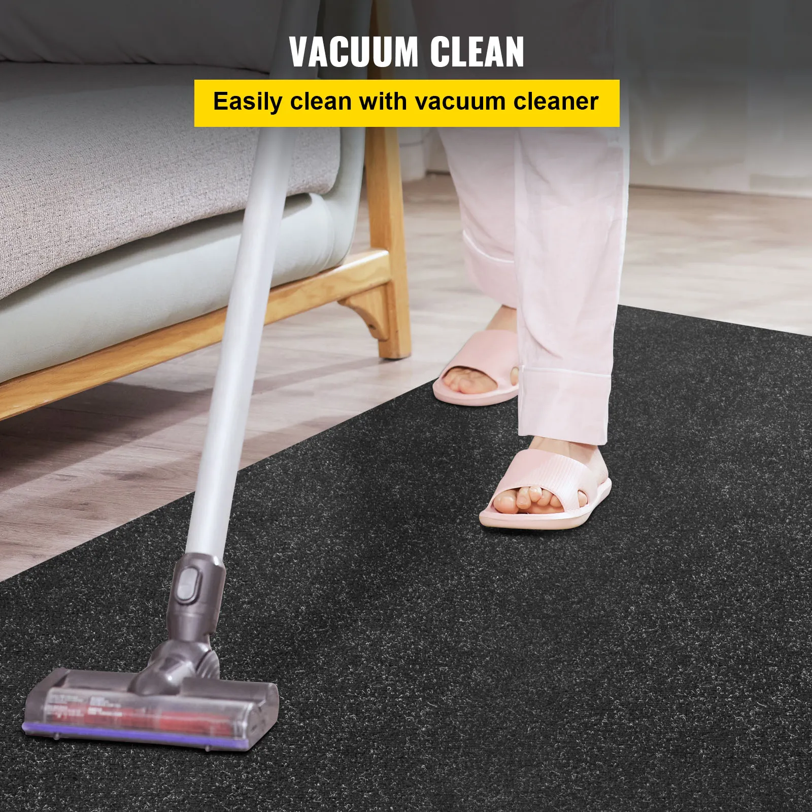vacuuming a black VEVOR marine carpet with ease, featuring person in slippers.