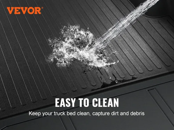 VEVOR truck bed mat being cleaned with a hose, showcasing its ease of maintenance.