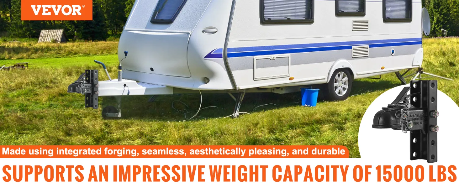 VEVOR adjustable trailer coupler attached to a travel trailer in a grassy field with a weight capacity of 15000 lbs.