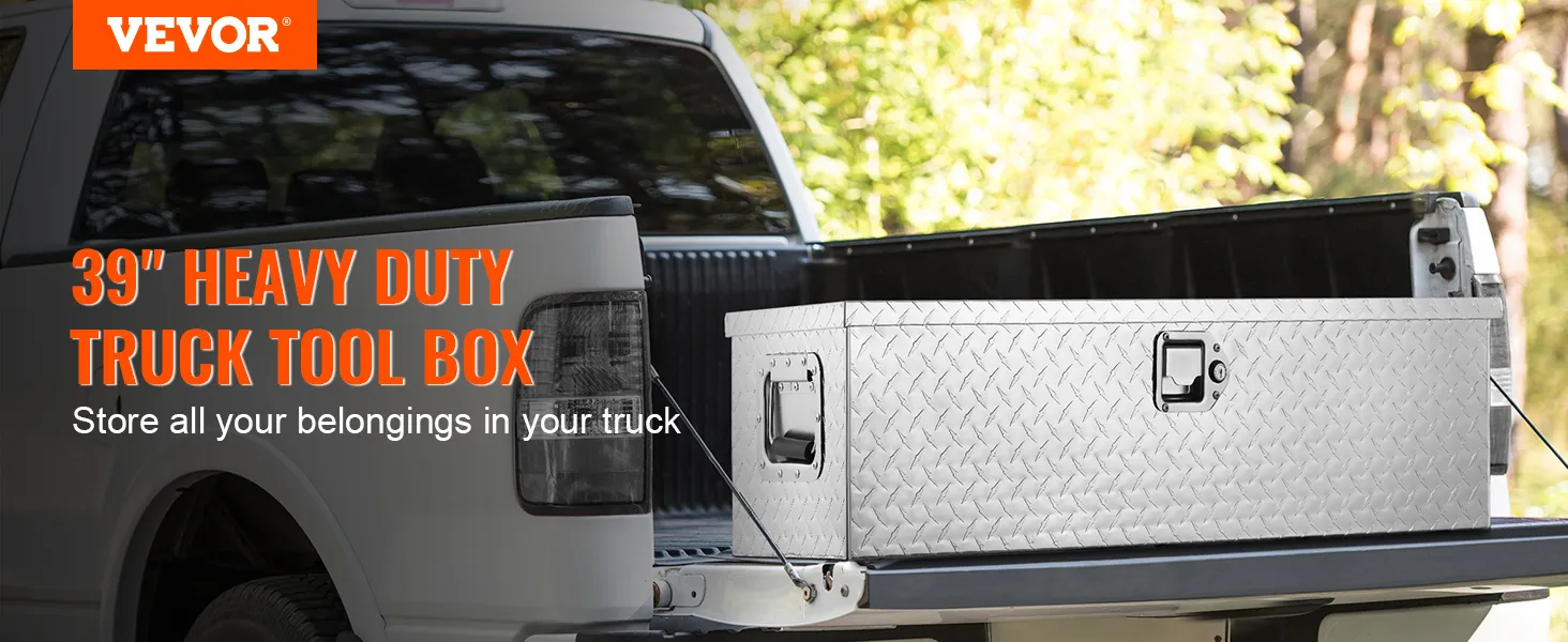 VEVOR truck bed tool box on white truck with open tailgate, forest background, store belongings securely.