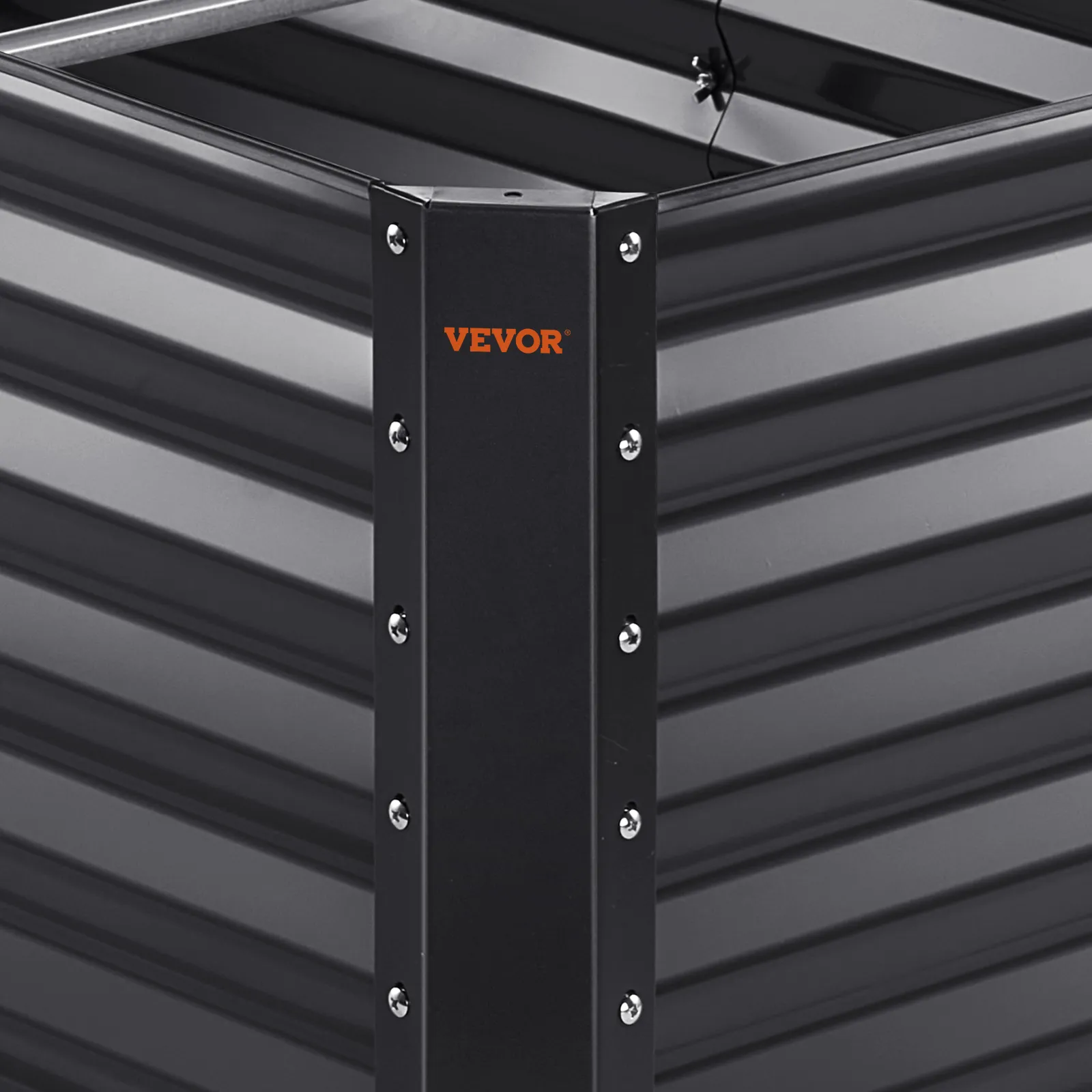 VEVOR garden bed corner detail with metallic screws and corrugated black panels.