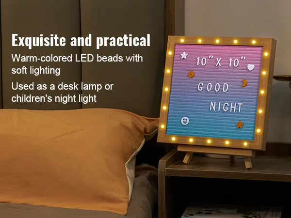 Tablero de letras de fieltro VEVOR con luces LED cálidas sobre una mesita de noche, que muestra "buenas noches".