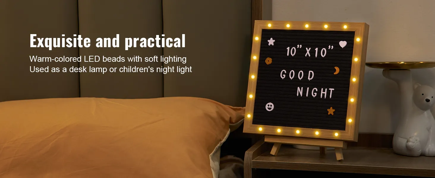 Tablero de letras de fieltro VEVOR con luces LED cálidas, que muestra "buenas noches" en una mesita de noche.