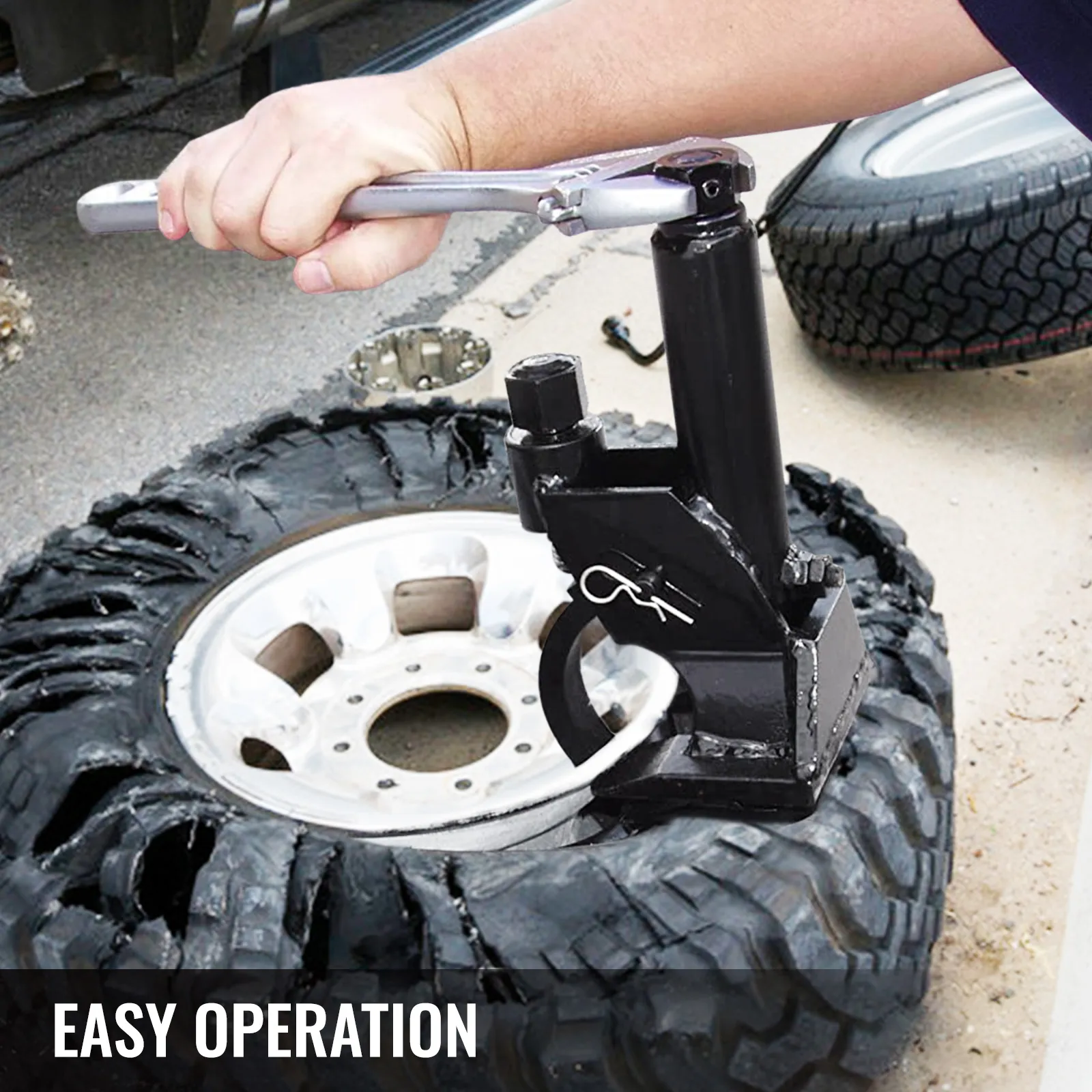 VEVOR manual tire bead breaker in use to remove tire from rim, showing easy operation.