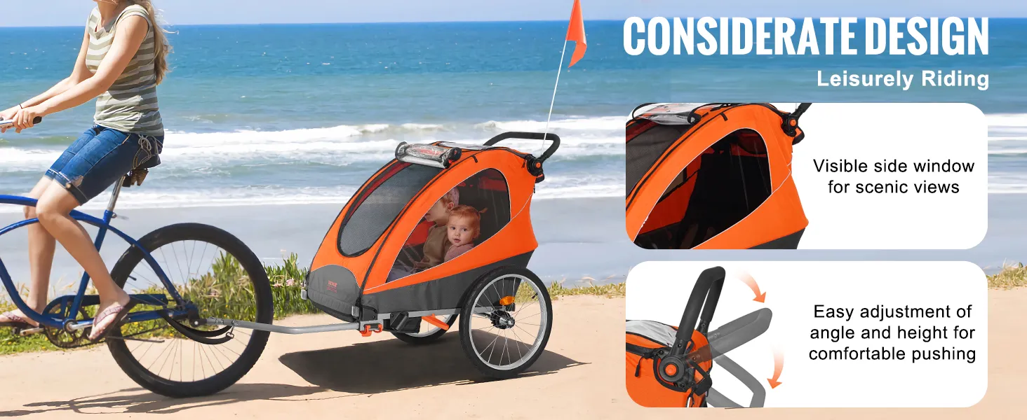 VEVOR bike trailer for toddlers being towed by a bicycle on a beachside path with scenic ocean views.