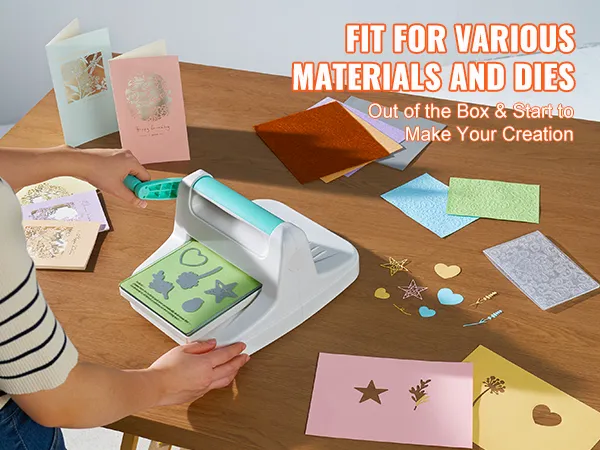 person using VEVOR die cutting machine on various materials and dies with cards on a wooden table.