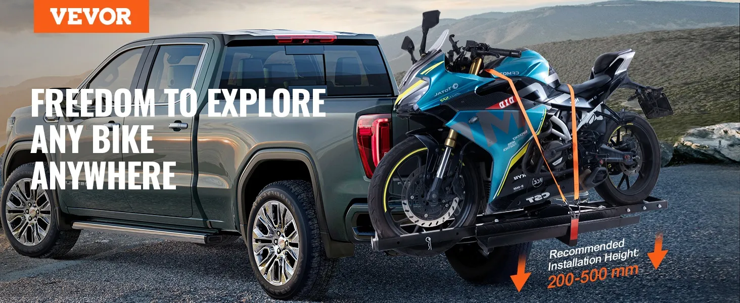VEVOR motorcycle carrier attached to a pickup truck, securing a blue motorcycle against a mountain backdrop.