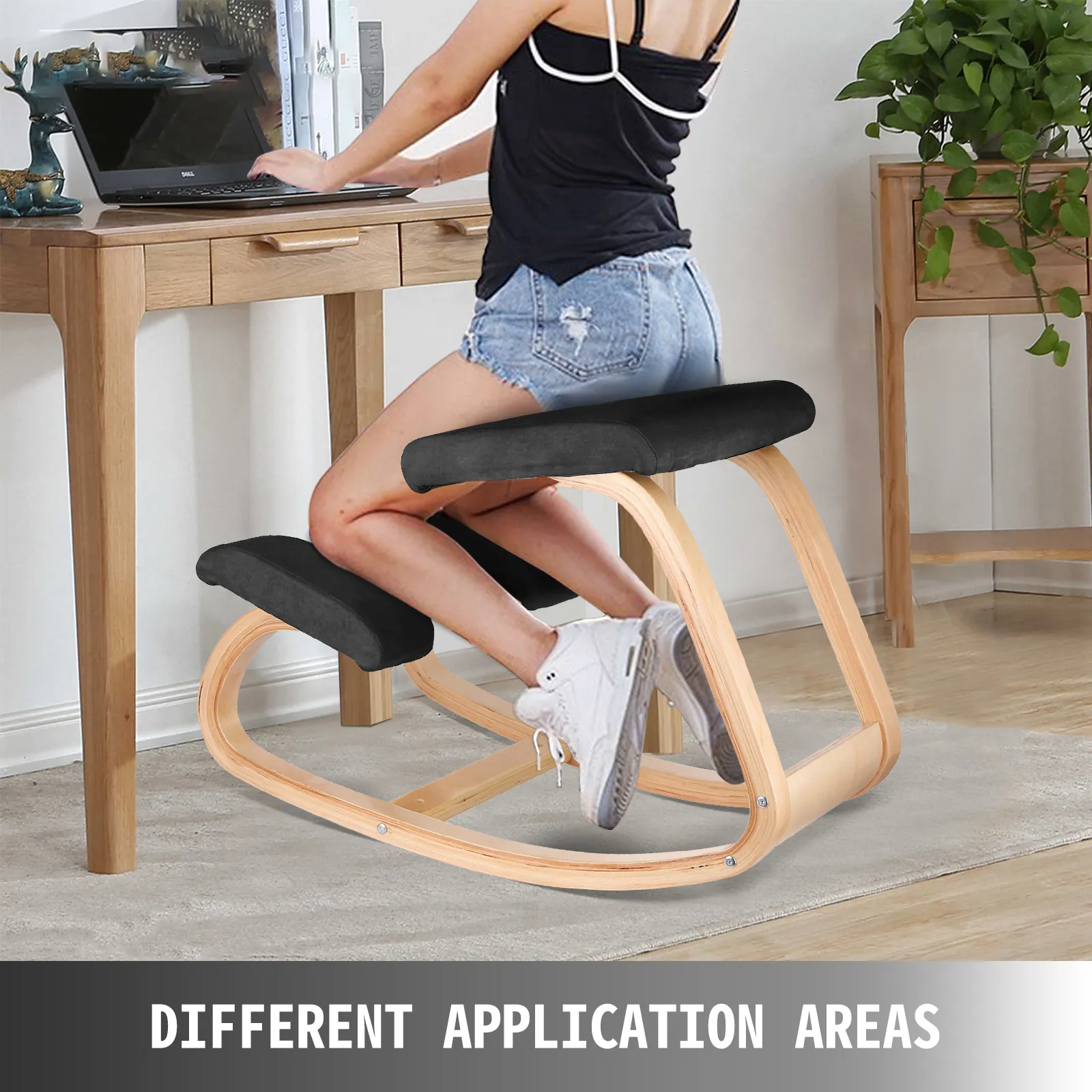 person using VEVOR ergonomic kneeling chair at wooden desk with laptop.