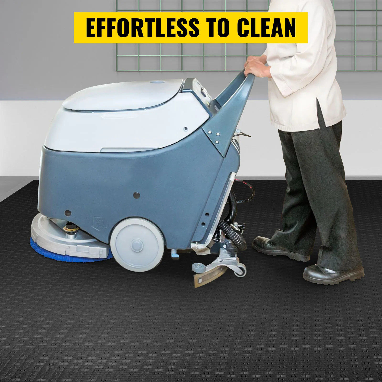 cleaning machine on VEVOR garage tiles with a person operating it. effortless to clean.