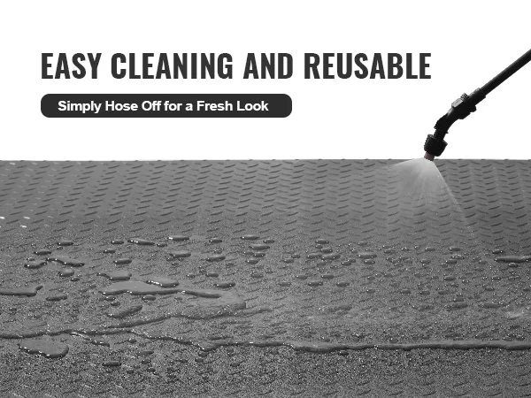 water being sprayed on VEVOR garage floor mats for easy cleaning and reuse.