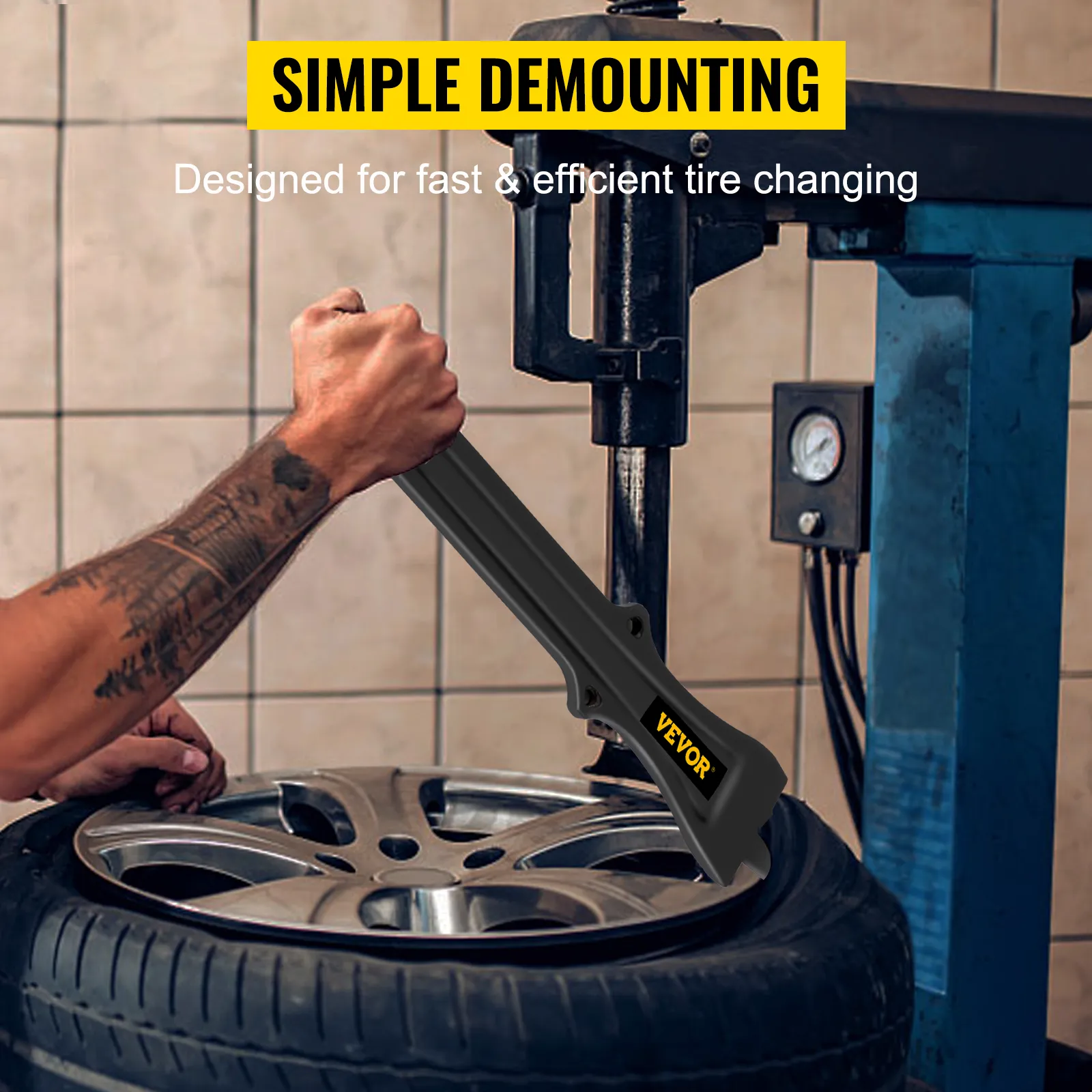 man using VEVOR tire changing tool for simple demounting on alloy wheel.
