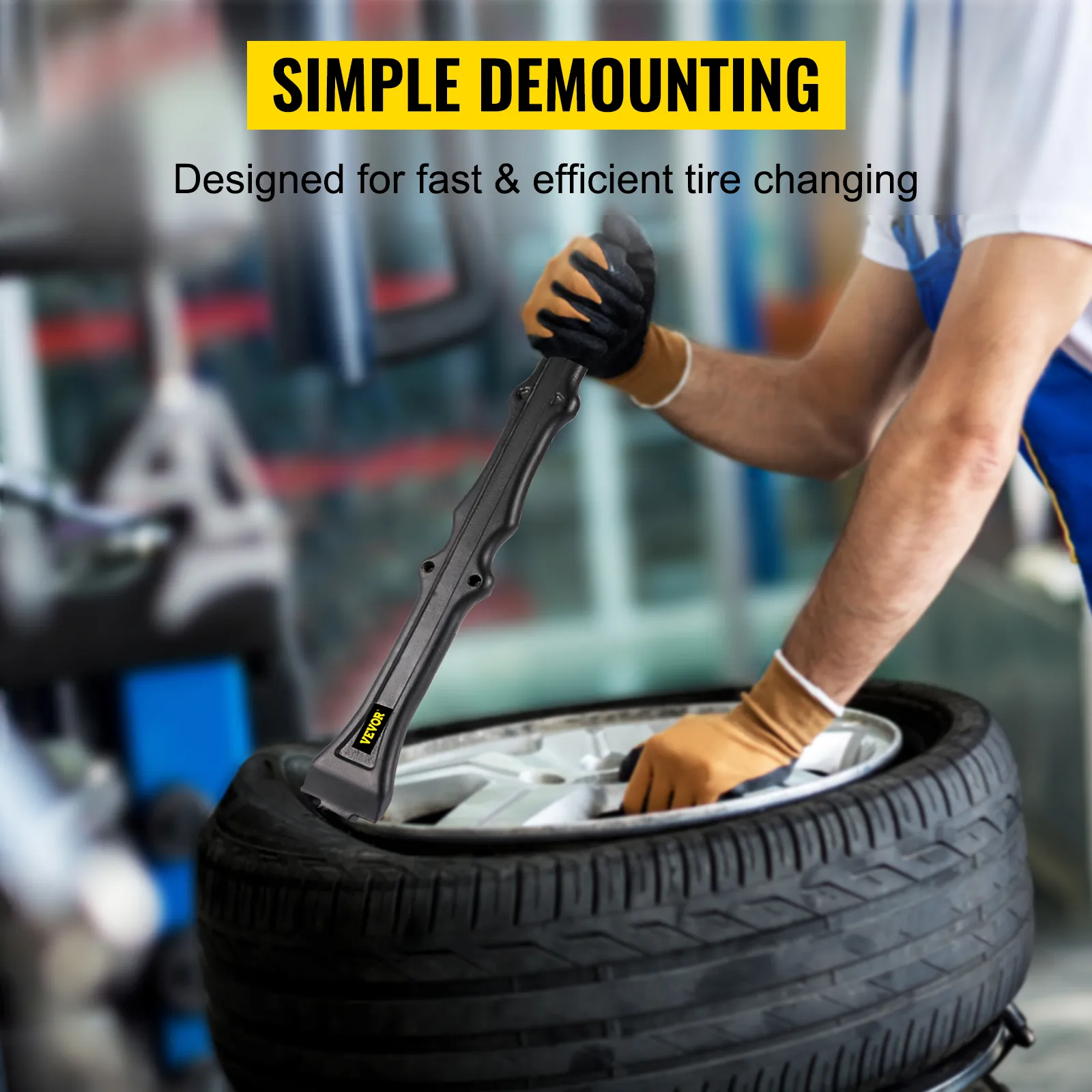 mechanic using the VEVOR tire iron set for quick tire demounting in a garage.