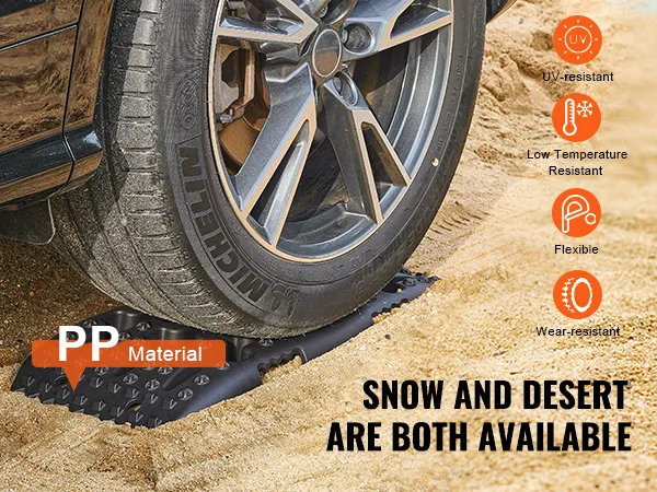 Rueda de automóvil sobre tablas de tracción VEVOR en arena, destacando la resistencia a los rayos UV, la flexibilidad y la resistencia al desgaste.