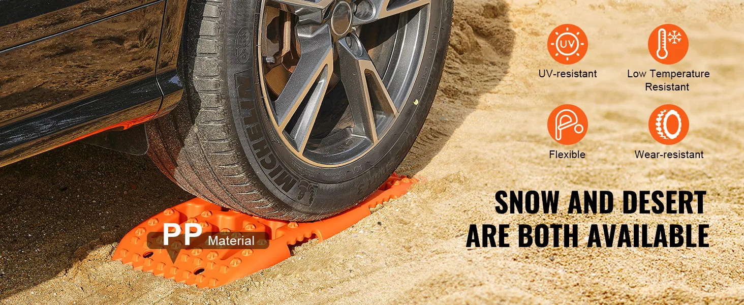 Tablas de tracción VEVOR debajo de un neumático de automóvil sobre arena, que muestran resistencia a los rayos UV, a las bajas temperaturas y al desgaste.