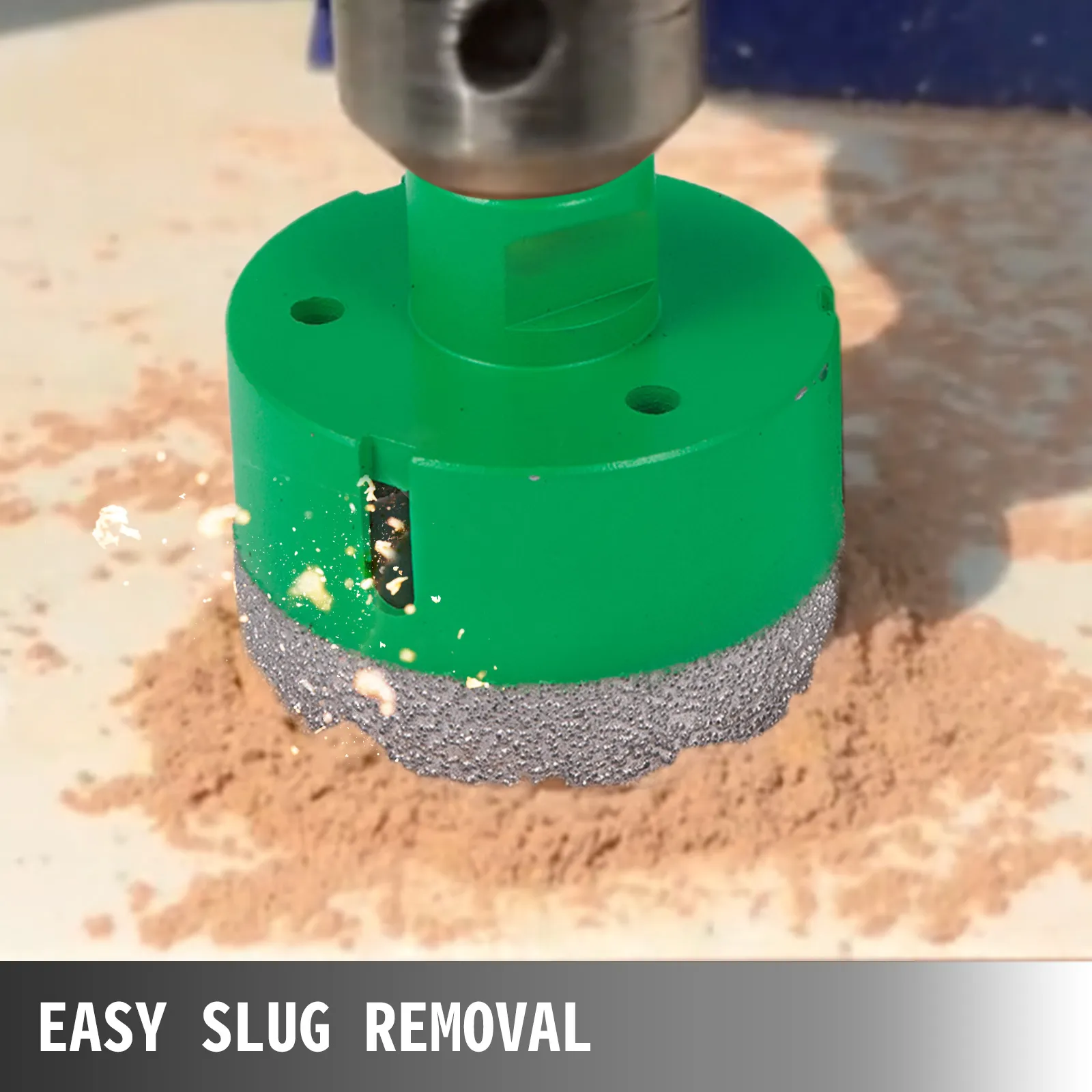 VEVOR diamond hole saw set drilling with easy slug removal on a dusty surface.