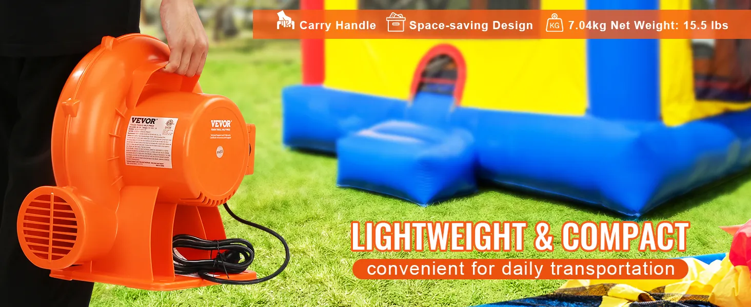 VEVOR bounce house blower being carried, with a colorful bounce house in the background.