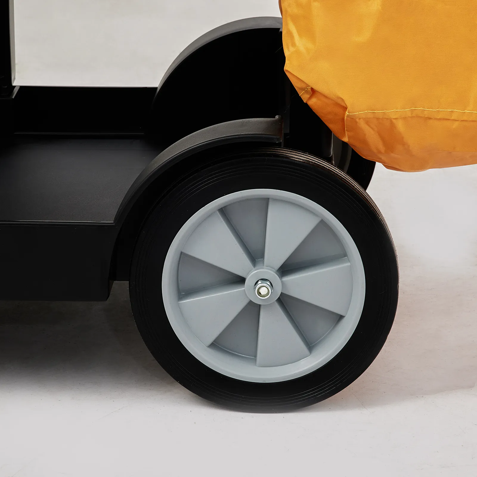 large rear wheel of the VEVOR cleaning cart with a yellow bag attachment.