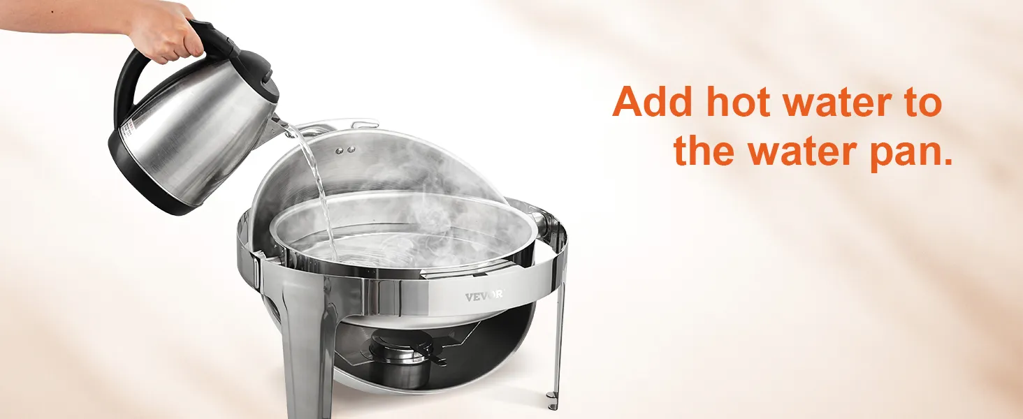adding hot water to VEVOR roll top chafing dish, steam rising from water pan.