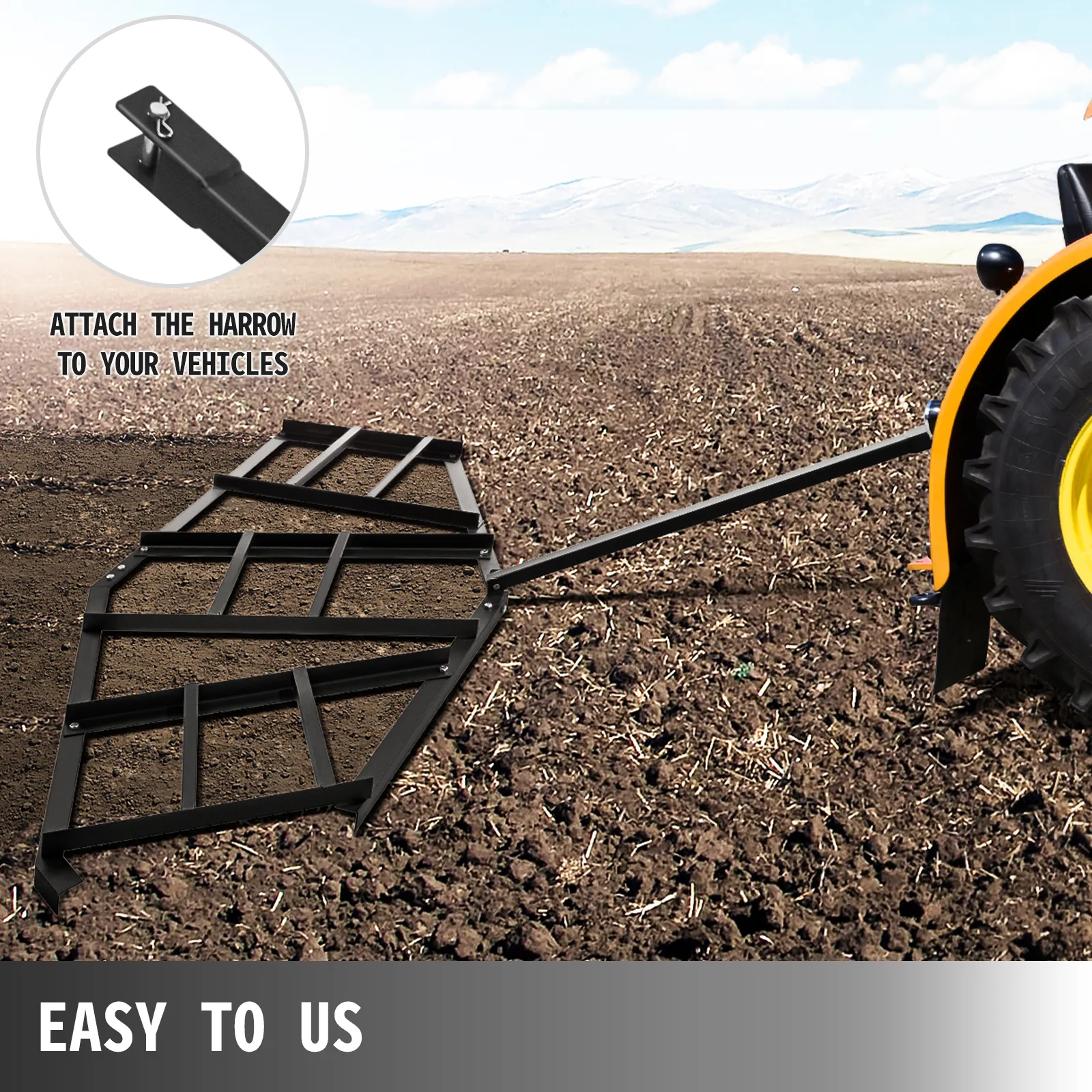 Arrastre de entrada de vehículos VEVOR acoplado a un tractor, nivelando el suelo en un campo abierto.