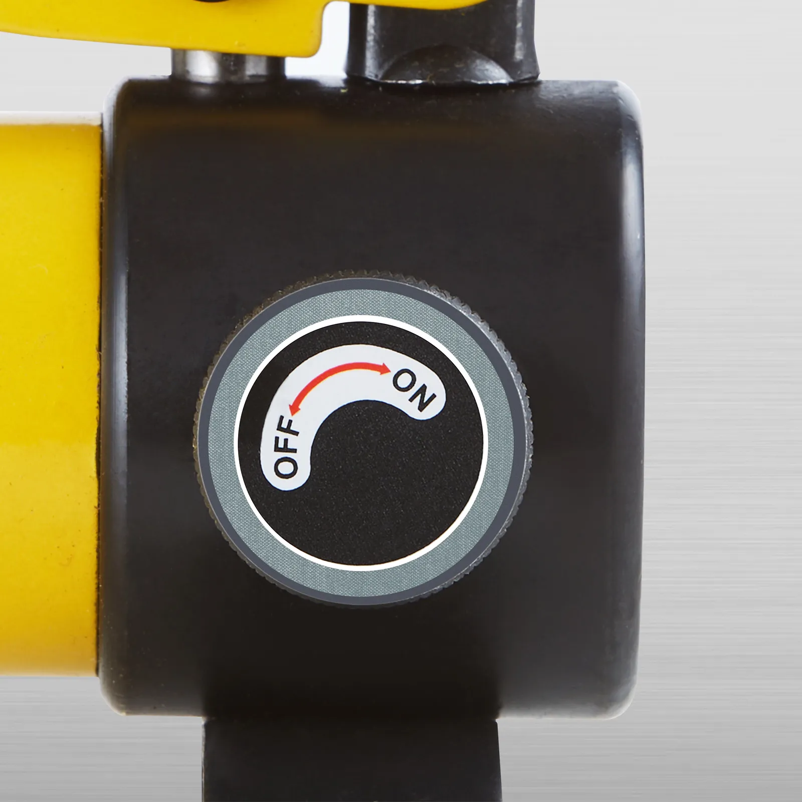 on-off switch close-up of VEVOR hydraulic knockout punch kit with yellow and black components.