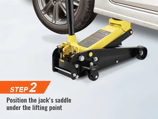 step 2: position the VEVOR floor jack's saddle under the lifting point of the car wheel.