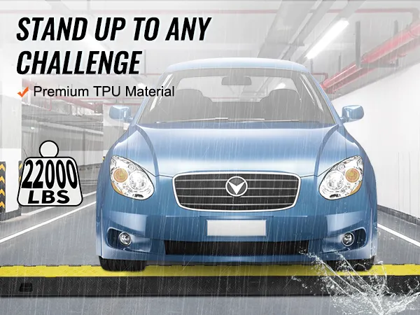 blue car drives over VEVOR cable protector ramp in rain, supporting 22000 lbs; made of premium tpu material.