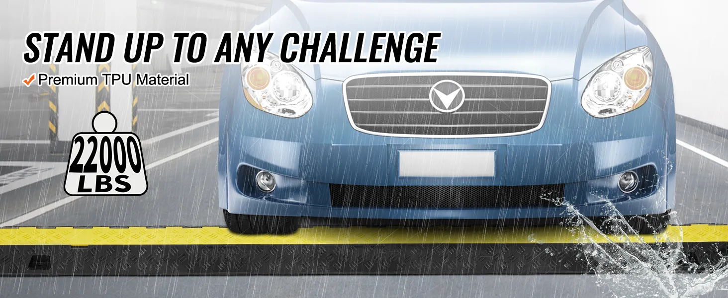 blue car drives over VEVOR cable protector ramp in rain, supporting 22000 lbs; made of premium tpu material.
