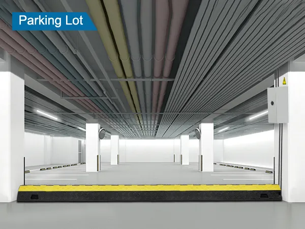 VEVOR cable protector ramp in an underground parking lot with colorful overhead pipes.