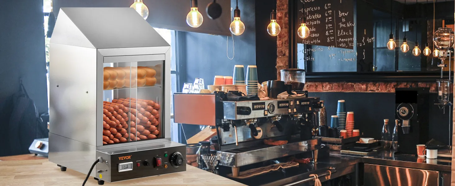 Vaporera para hot dogs VEVOR en una acogedora cafetería con paredes de ladrillo a la vista y bombillas colgantes.