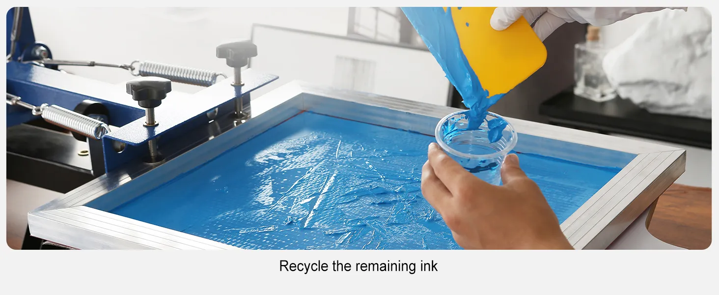 hand using squeegee to recycle blue ink in the VEVOR screen printing kit.