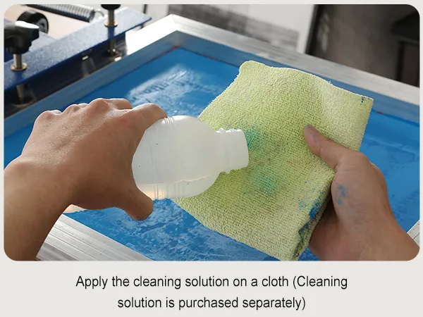 hand applying cleaning solution with a cloth to a VEVOR screen printing kit.