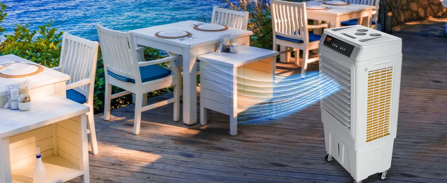outdoor dining area cooled by VEVOR evaporative air cooler with ocean view, white furniture, and greenery.