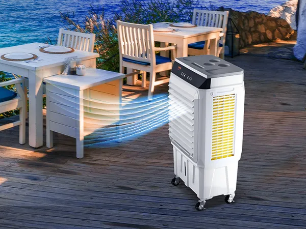 VEVOR evaporative air cooler blowing cool air at outdoor dining area with ocean view and white wooden furniture.